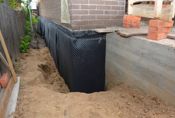 SJ Waterproofing Pros technician performing targeted Exterior Waterproofing assessment in Albertville, MN